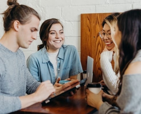 A group of employees sharing a coffee at work