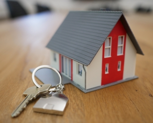 Small toy house and a set of house keys