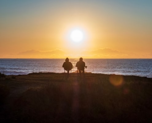 Retired couple looking at the sea