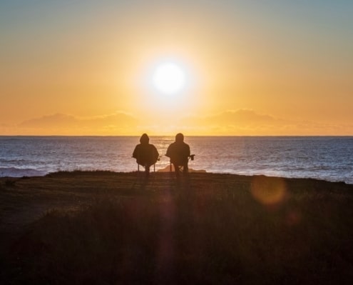 Retired couple looking at the sea
