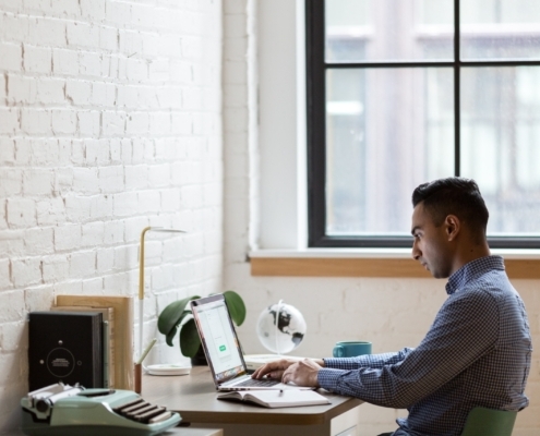 Man in office working alone on computer