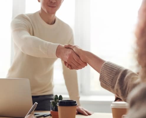 Man and woman shaking hands