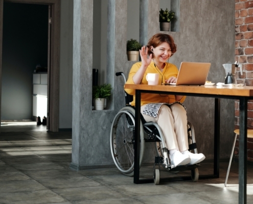 Professional woman in a wheelchair doing a video call